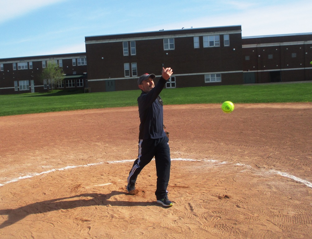 Brighton Town Council Member Jason DiPonzio shows his stuff at the first  pitch at the Game at the Corners - Talker of the Town